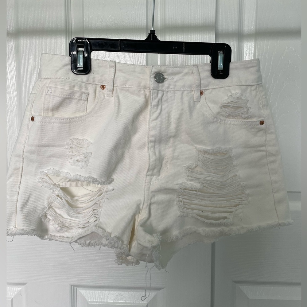 White ripped jeans shorts from Pacsun in a size 26 waist.